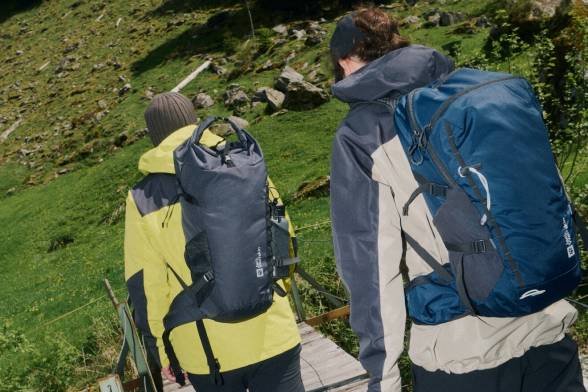 Young woman in sporty, summery hiking clothes with a sporty shoulder&nbsp;bag